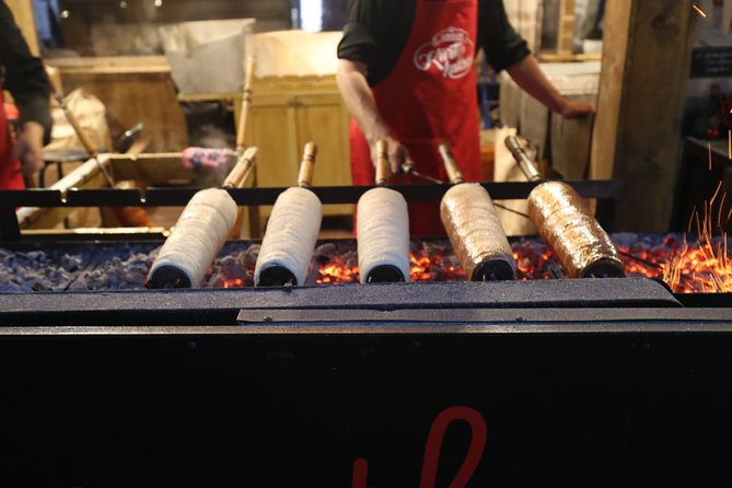 Budapest Christmas Market Tour with Basilica visit & Chimney cake - Tasting chimney cake, lángos, and warm holiday drinks