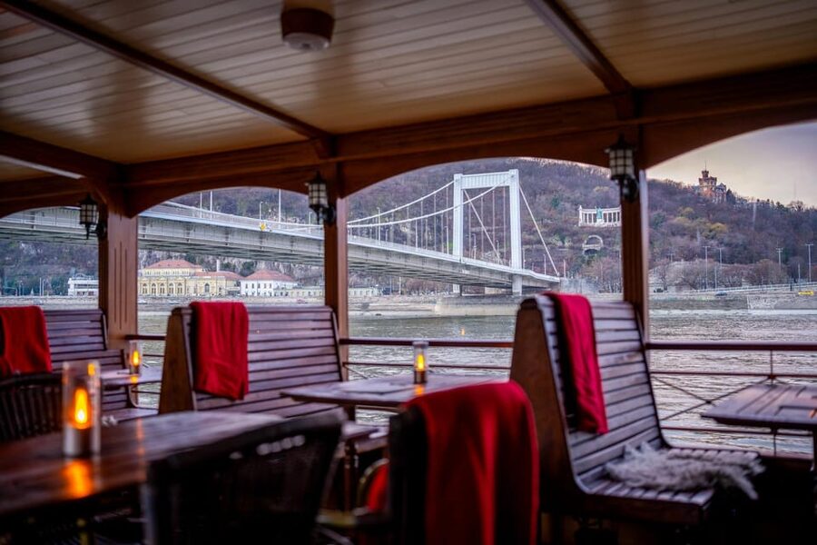 Budapest: Historic Cruise with Welcome Drink - Passing the bridges toward Parliament