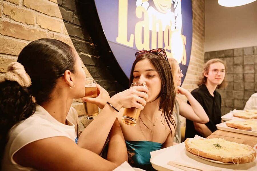 Guided Tipsy Food Tour with Drinks Included in Budapest - Walking through the former Jewish Quarter